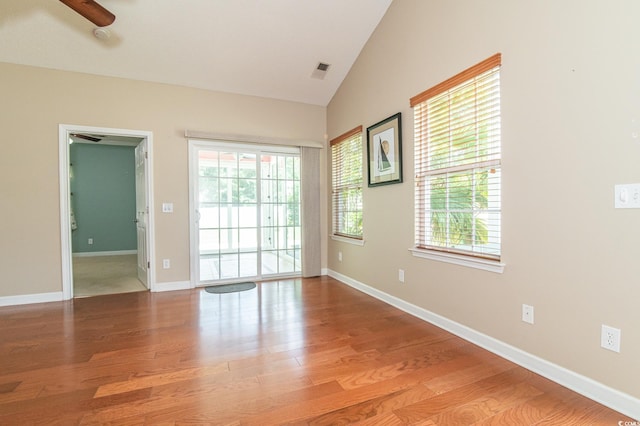 111 Rose Water Loop, Myrtle Beach, SC 29588 - empty room featuring wood finished floors, healthy amount of natural light, and vaulted ceiling