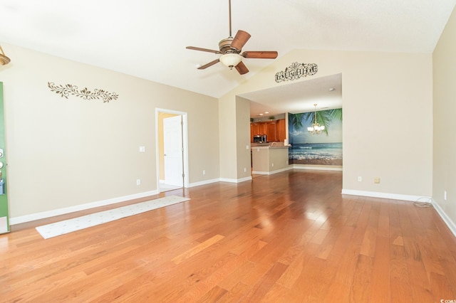 111 Rose Water Loop, Myrtle Beach, SC 29588 - unfurnished living room featuring ceiling fan, light wood-type flooring, vaulted ceiling, and a chandelier