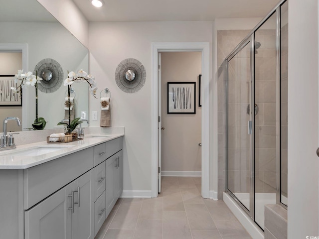 4861 Hopespring St, Myrtle Beach, SC 29579 - bathroom with double vanity, a shower stall, baseboards, tile patterned floors, and recessed lighting
