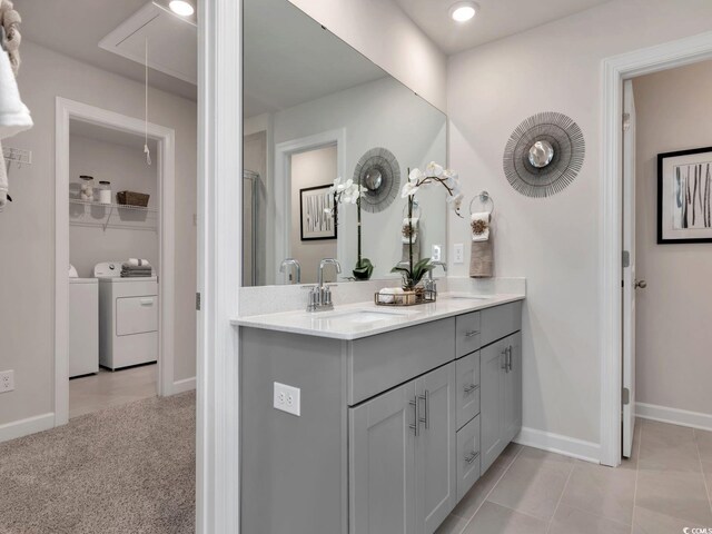 4861 Hopespring St, Myrtle Beach, SC 29579 - full bathroom with washer and clothes dryer, double vanity, baseboards, recessed lighting, and a shower with shower door