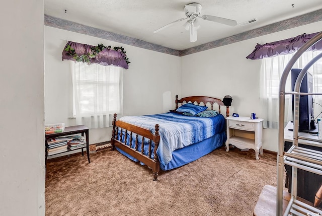 bedroom with carpet floors, a ceiling fan, and baseboards