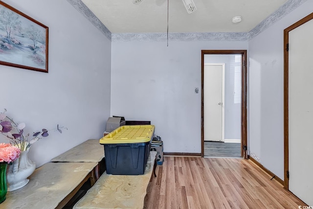 misc room with wood finished floors and baseboards