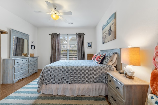 bedroom featuring wood finished floors and a ceiling fan