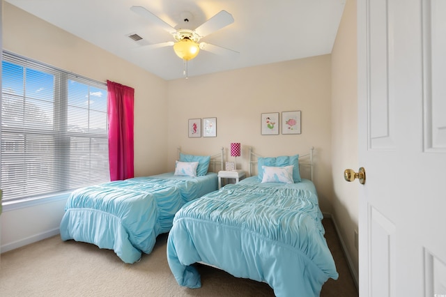 bedroom with baseboards, carpet, and a ceiling fan