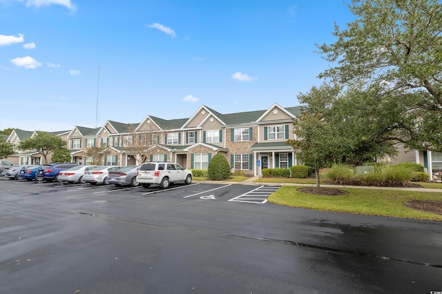uncovered parking lot with a residential view