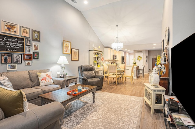 2016 Willow Run Dr Unit B, Little River, SC 29566 - living room with high vaulted ceiling, light wood-style floors, a chandelier, and recessed lighting