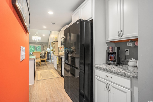 2016 Willow Run Dr Unit B, Little River, SC 29566 - kitchen featuring black appliances, light wood-style floors, white cabinetry, recessed lighting, and light stone countertops