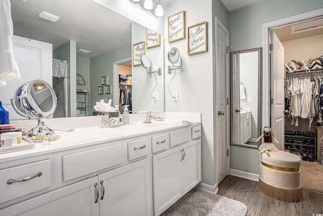 2016 Willow Run Dr Unit B, Little River, SC 29566 - full bath with wood finished floors, vanity, a walk in closet, and baseboards