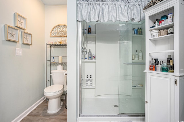 2016 Willow Run Dr Unit B, Little River, SC 29566 - bathroom with wood finished floors, a stall shower, toilet, and baseboards