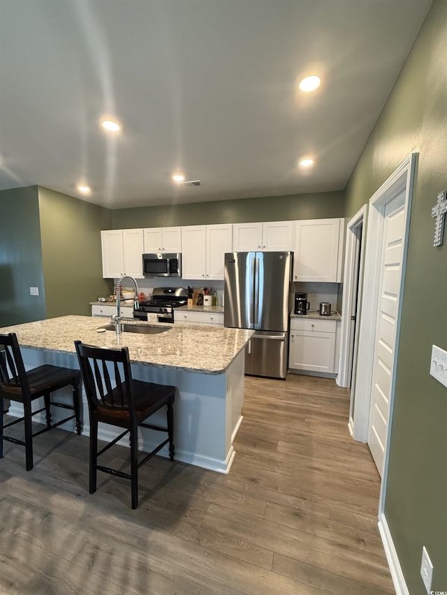 787 Dusty Pine Way, Myrtle Beach, SC 29588 - kitchen with stainless steel appliances, a sink, recessed lighting, dark wood-type flooring, and white cabinetry