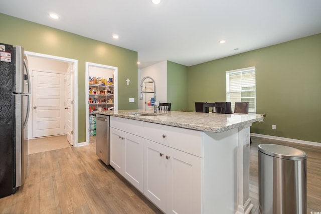 787 Dusty Pine Way, Myrtle Beach, SC 29588 - kitchen with a sink, stainless steel appliances, light wood-style flooring, white cabinetry, and recessed lighting