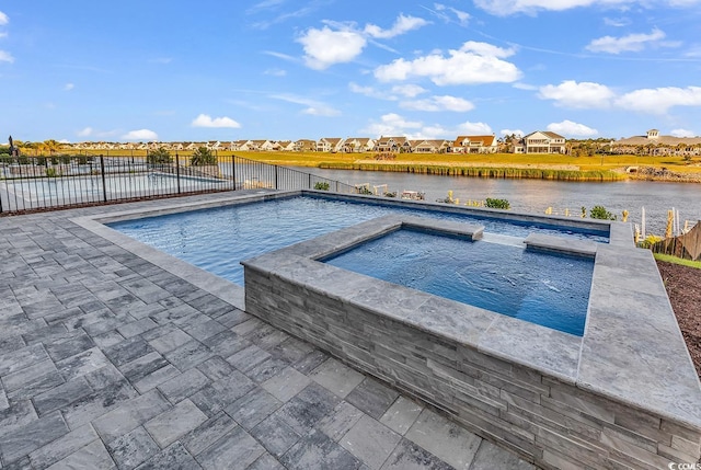 441 Saint Julian Ln, Myrtle Beach, SC 29579 - view of pool featuring fence, a pool with connected hot tub, a patio, and a residential view