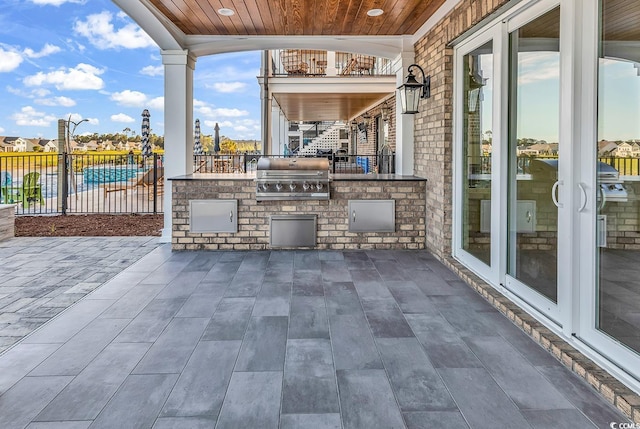 441 Saint Julian Ln, Myrtle Beach, SC 29579 - view of patio / terrace featuring a grill, an outdoor kitchen, and fence