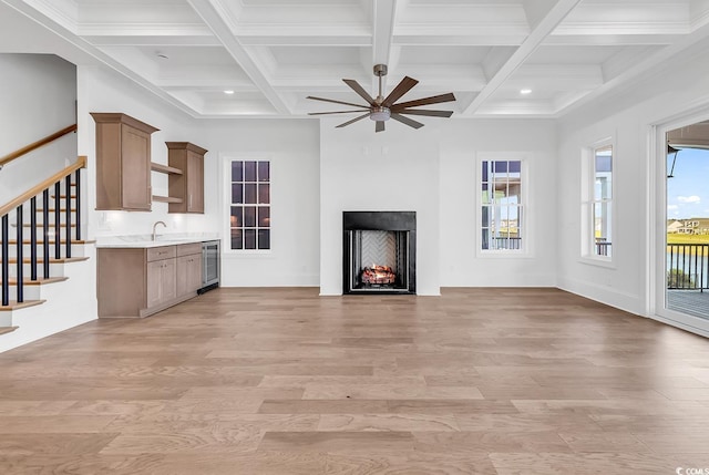 441 Saint Julian Ln, Myrtle Beach, SC 29579 - unfurnished living room with beverage cooler, coffered ceiling, a ceiling fan, light wood-type flooring, and beamed ceiling
