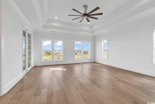 441 Saint Julian Ln, Myrtle Beach, SC 29579 - spare room featuring a raised ceiling, crown molding, light wood finished floors, baseboards, and recessed lighting