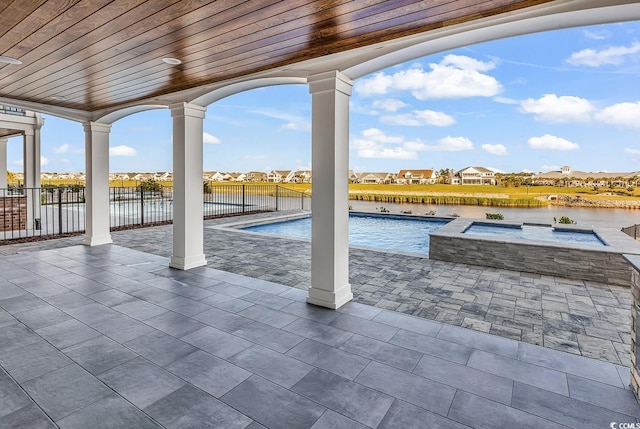441 Saint Julian Ln, Myrtle Beach, SC 29579 - view of pool with a patio, a residential view, fence, a pool with connected hot tub, and a water view