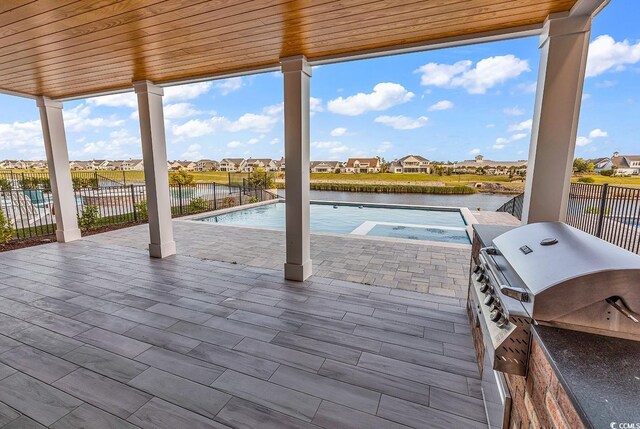 437 Saint Julian Ln, Myrtle Beach, SC 29579 - view of patio featuring area for grilling, a residential view, and a water view