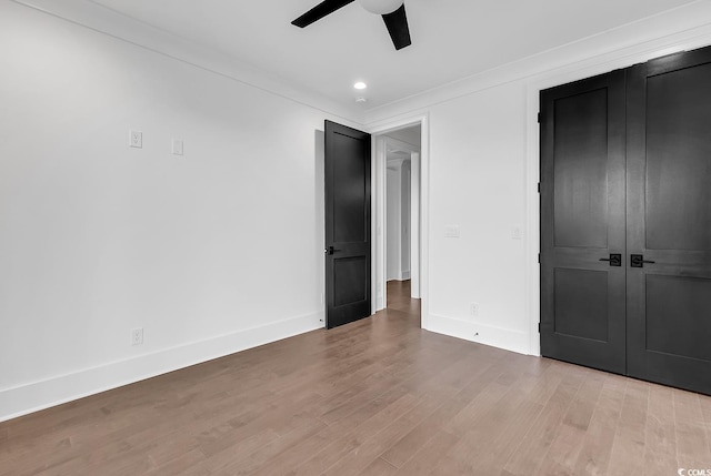 437 Saint Julian Ln, Myrtle Beach, SC 29579 - unfurnished bedroom with wood finished floors, baseboards, a closet, and ceiling fan