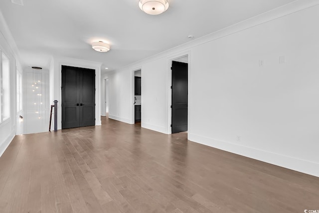 437 Saint Julian Ln, Myrtle Beach, SC 29579 - spare room featuring dark wood-type flooring, baseboards, and ornamental molding