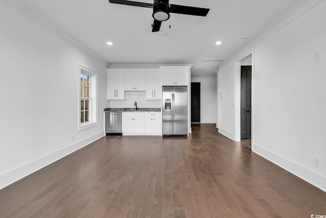 437 Saint Julian Ln, Myrtle Beach, SC 29579 - kitchen featuring appliances with stainless steel finishes, a sink, white cabinets, a ceiling fan, and dark wood finished floors