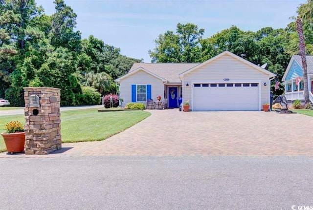 901 Southwind Ct, Garden City Beach, SC 29576 - ranch-style house with a front lawn, an attached garage, and decorative driveway
