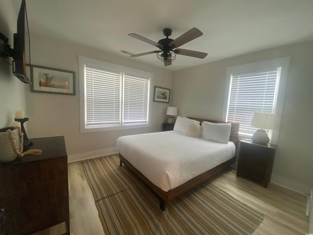 6205 Nixon St, North Myrtle Beach, SC 29582 - bedroom featuring baseboards, light wood-style floors, and a ceiling fan