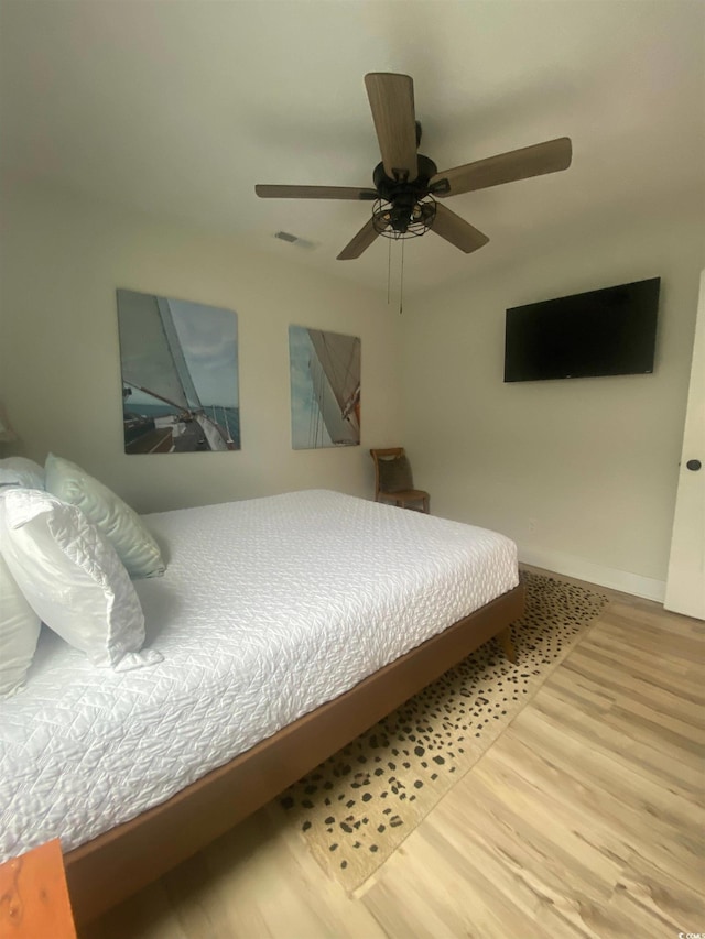6205 Nixon St, North Myrtle Beach, SC 29582 - bedroom featuring wood finished floors and ceiling fan