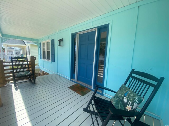 6205 Nixon St, North Myrtle Beach, SC 29582 - wooden terrace with covered porch