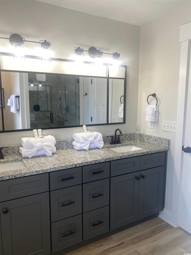 6205 Nixon St, North Myrtle Beach, SC 29582 - full bath with wood finished floors, a shower stall, and double vanity