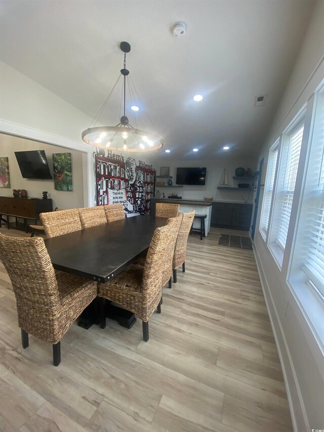 6205 Nixon St, North Myrtle Beach, SC 29582 - dining area featuring baseboards, light wood-style floors, recessed lighting, and lofted ceiling