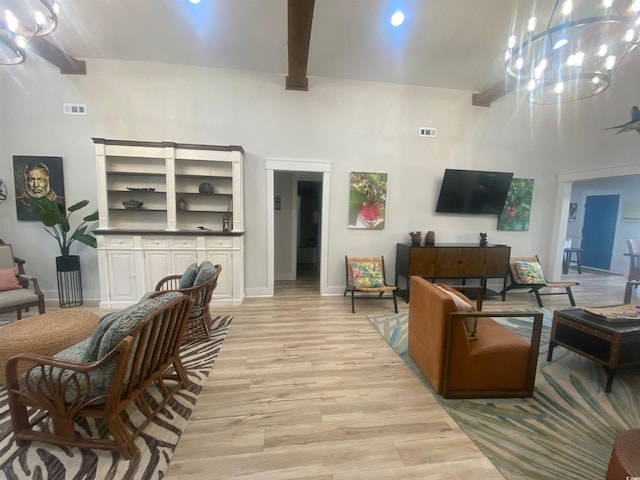 6205 Nixon St, North Myrtle Beach, SC 29582 - living room with a chandelier, light wood-style floors, beam ceiling, baseboards, and a high ceiling