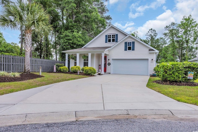 traditional-style house featuring driveway and covered porch