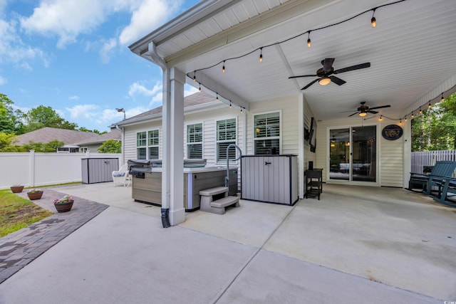 1009 Oak Marsh Ln, North Myrtle Beach, SC 29582 - view of patio / terrace with a hot tub, fence, and ceiling fan