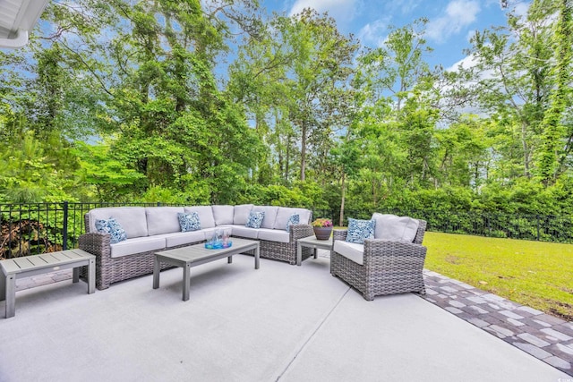 view of patio with an outdoor living space and view of scattered trees