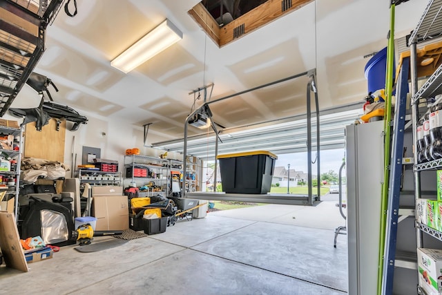 1009 Oak Marsh Ln, North Myrtle Beach, SC 29582 - garage featuring a garage door opener