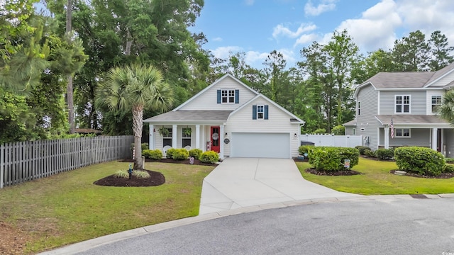 traditional home featuring a garage and driveway