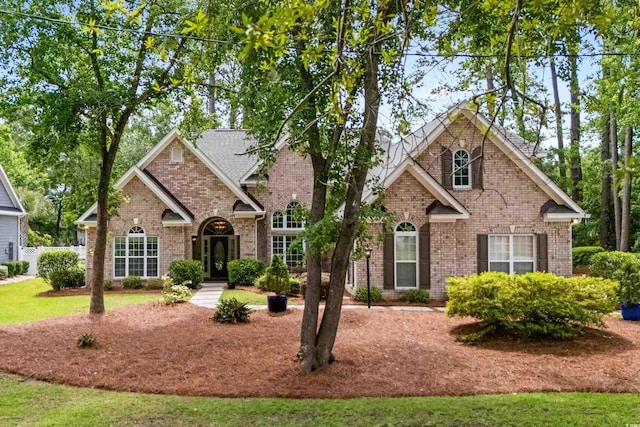 traditional-style house with brick siding