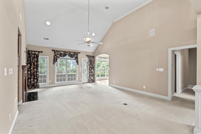 unfurnished living room featuring light colored carpet, ceiling fan, baseboards, and high vaulted ceiling