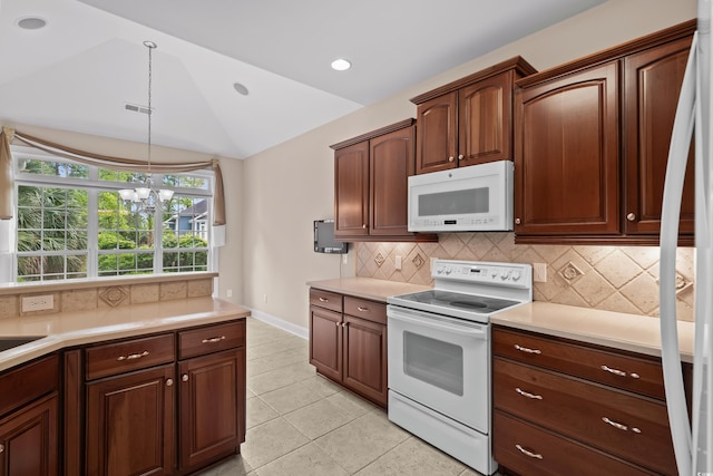 kitchen with white appliances, lofted ceiling, light countertops, backsplash, and decorative light fixtures