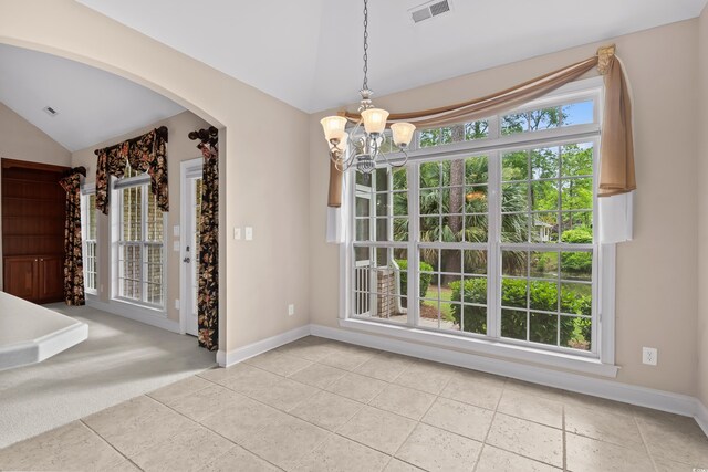 1315 Cherry Dr, Surfside Beach, SC 29575 - unfurnished dining area featuring vaulted ceiling, a chandelier, arched walkways, and light tile patterned floors
