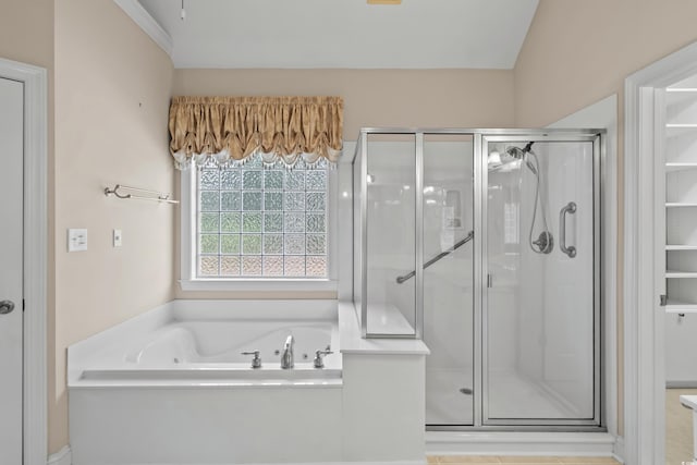 full bathroom featuring a shower stall and a bath