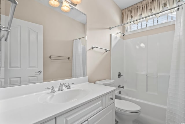 bathroom with toilet, vanity, and shower / bath combo with shower curtain