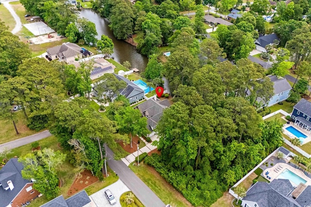 aerial perspective of suburban area featuring a large body of water