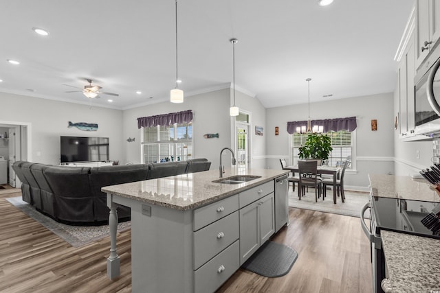 322 Canyon Dr, Conway, SC 29526 - kitchen featuring a sink, stainless steel appliances, ceiling fan, wood finished floors, and a center island with sink