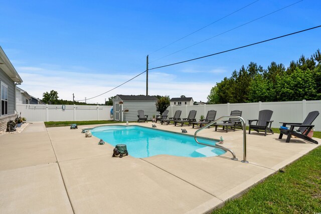 322 Canyon Dr, Conway, SC 29526 - view of swimming pool featuring a patio, a fenced backyard, a shed, and an outbuilding