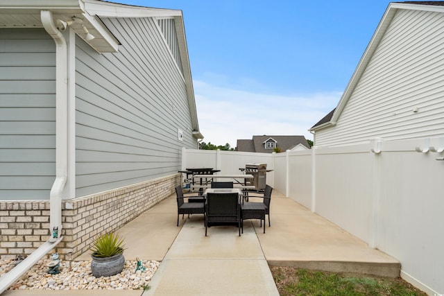 322 Canyon Dr, Conway, SC 29526 - view of patio featuring outdoor dining area, a fenced backyard, and area for grilling