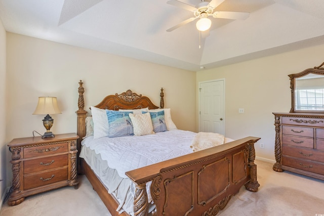 bedroom featuring light colored carpet, a ceiling fan, and lofted ceiling