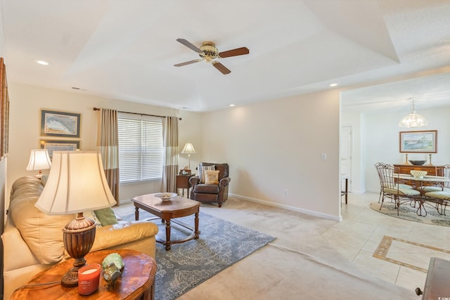 living area with a ceiling fan, recessed lighting, a chandelier, light tile patterned floors, and baseboards