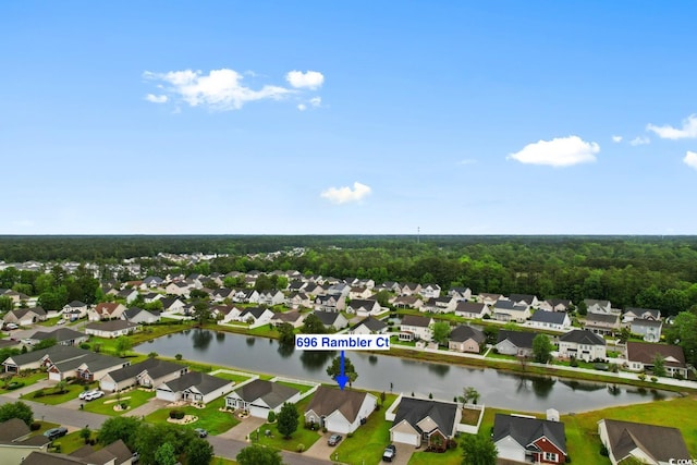 aerial view of residential area with a nearby body of water