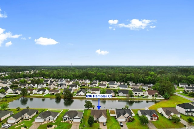 aerial perspective of suburban area featuring a nearby body of water